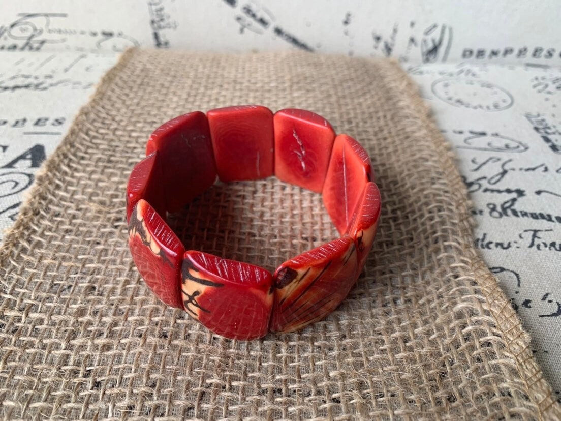 Red beaded bracelet Tagua nut jewelry Spring fashion trends Elastic stretch bracelet Geometric beads bracelet Art to wear Wide cuff bracelet