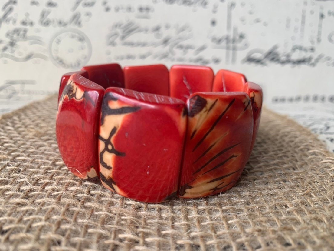 Red beaded bracelet Tagua nut jewelry Spring fashion trends Elastic stretch bracelet Geometric beads bracelet Art to wear Wide cuff bracelet
