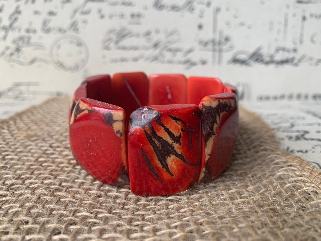Red beaded bracelet Tagua nut jewelry Spring fashion trends Elastic stretch bracelet Geometric beads bracelet Art to wear Wide cuff bracelet