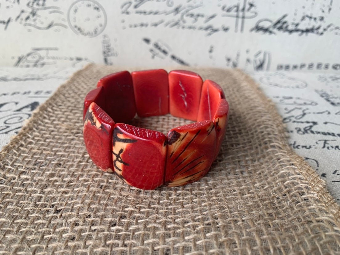 Red beaded bracelet Tagua nut jewelry Spring fashion trends Elastic stretch bracelet Geometric beads bracelet Art to wear Wide cuff bracelet