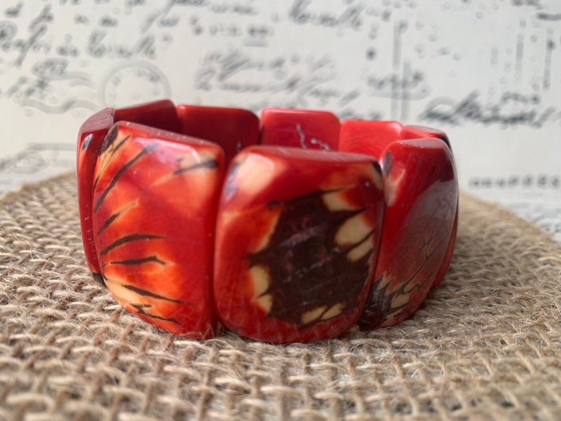 Red beaded bracelet Tagua nut jewelry Spring fashion trends Elastic stretch bracelet Geometric beads bracelet Art to wear Wide cuff bracelet