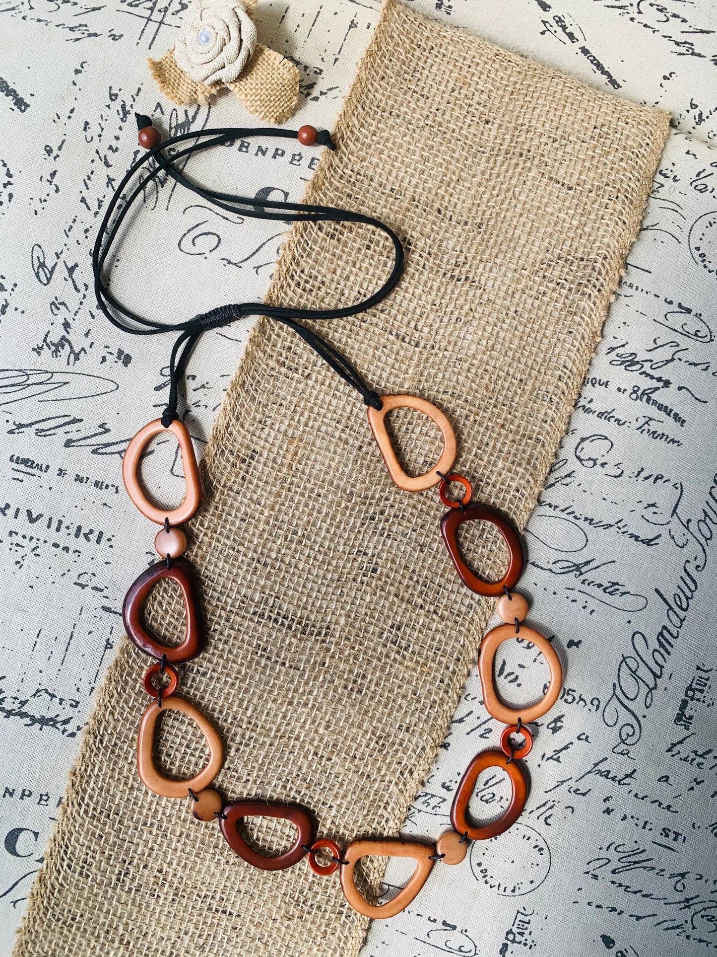 Brown Tagua necklace Fall fashion trends 2023 Statement geometric jewelry Donut beads Modern adjustable collar Lightweight extra long