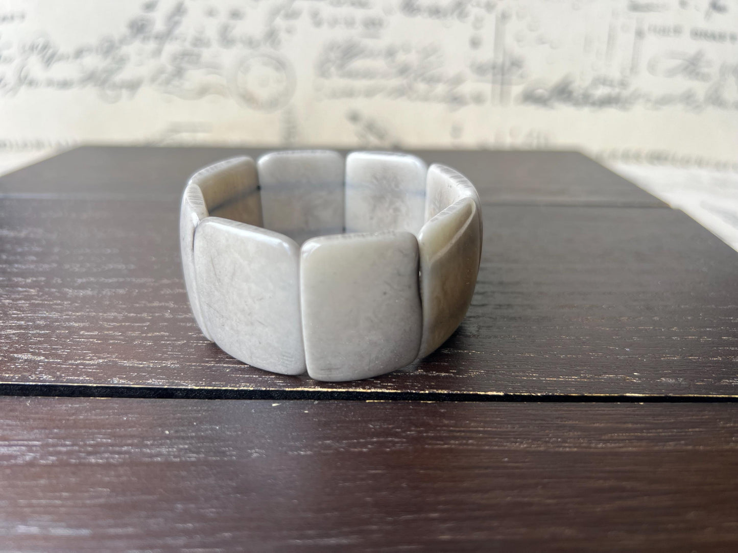 Grey beaded bracelet Tagua nut jewelry Wide cuff bangle Art to wear Elastic stretch bracelet Fall fashion 2025 Wearable art Statement bangle