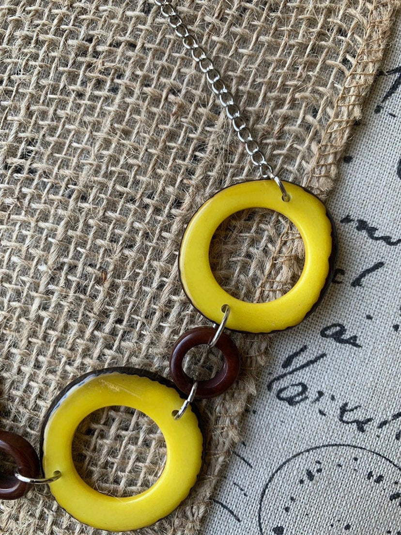 Yellow Tagua nut necklace with silver chain Resort wear Lightweight jewelry Statement handmade beads Spring fashion trends Beach style