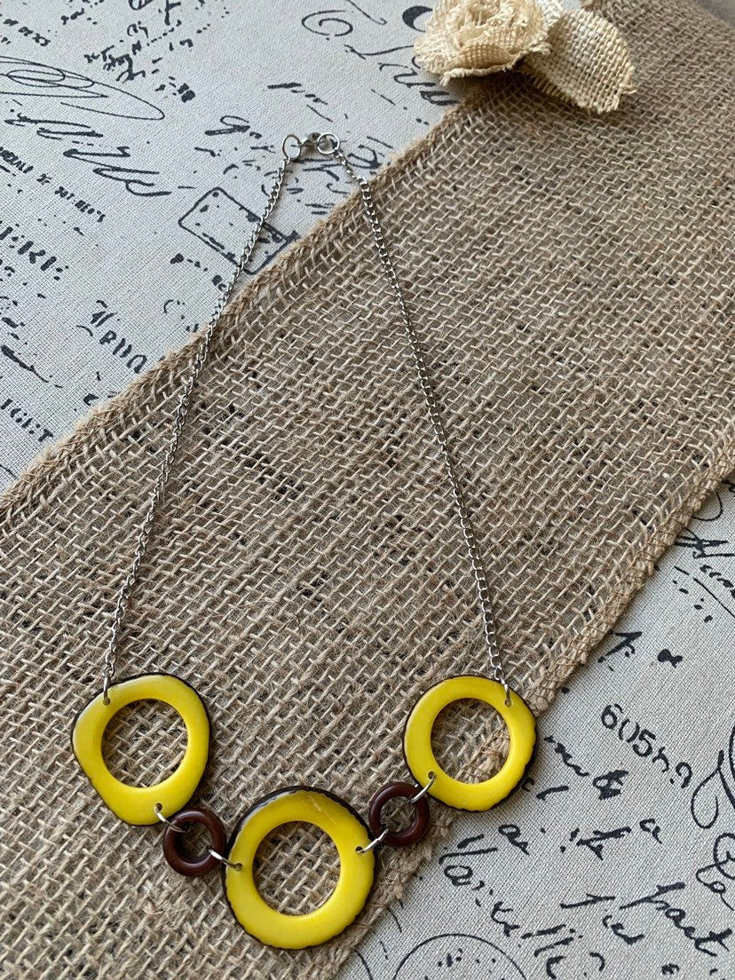 Yellow Tagua nut necklace with silver chain Resort wear Lightweight jewelry Statement handmade beads Spring fashion trends Beach style