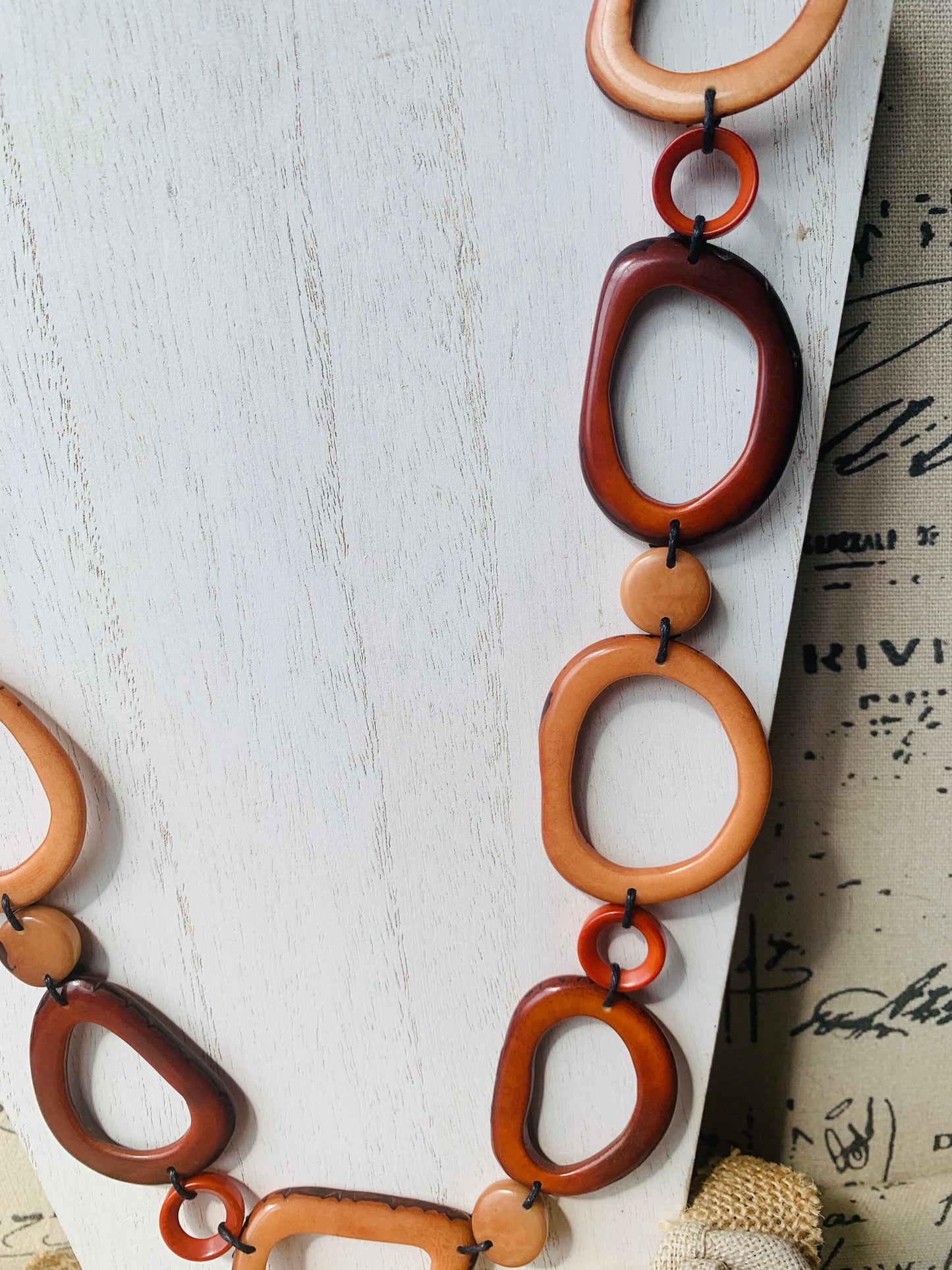 Brown Tagua necklace Fall fashion trends 2023 Statement geometric jewelry Donut beads Modern adjustable collar Lightweight extra long