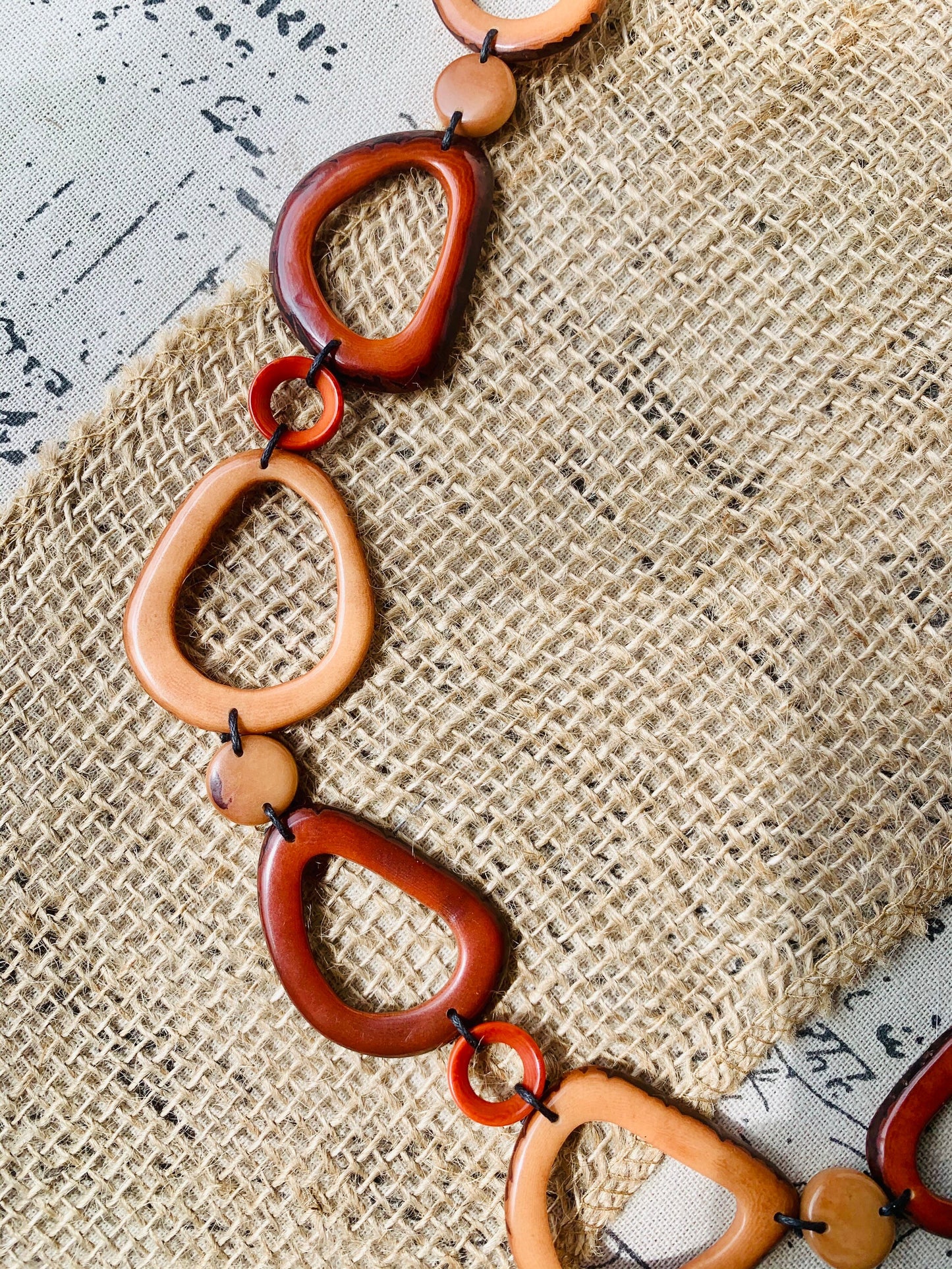 Brown Tagua necklace Fall fashion trends 2023 Statement geometric jewelry Donut beads Modern adjustable collar Lightweight extra long