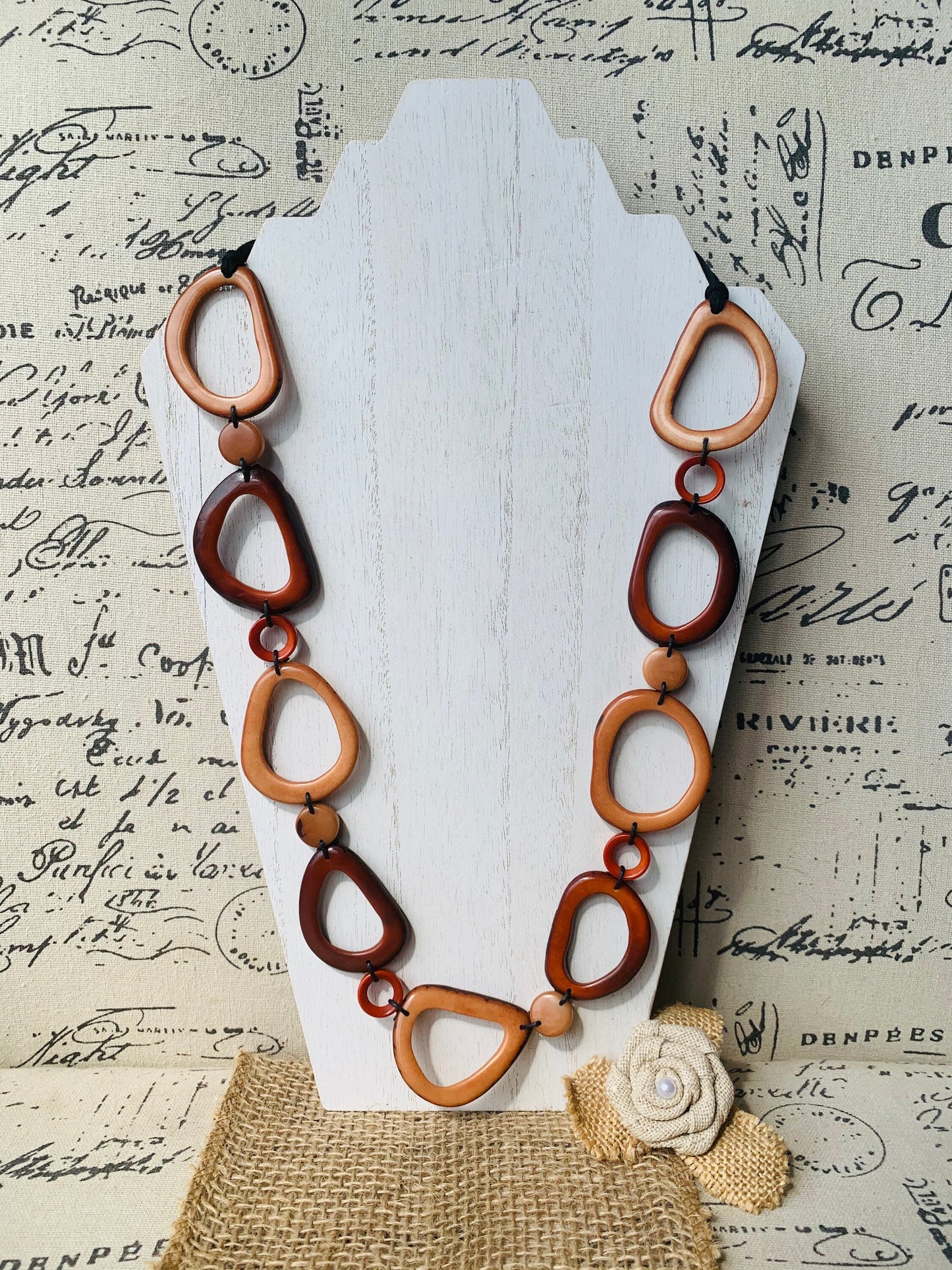 Brown Tagua necklace Fall fashion trends 2023 Statement geometric jewelry Donut beads Modern adjustable collar Lightweight extra long