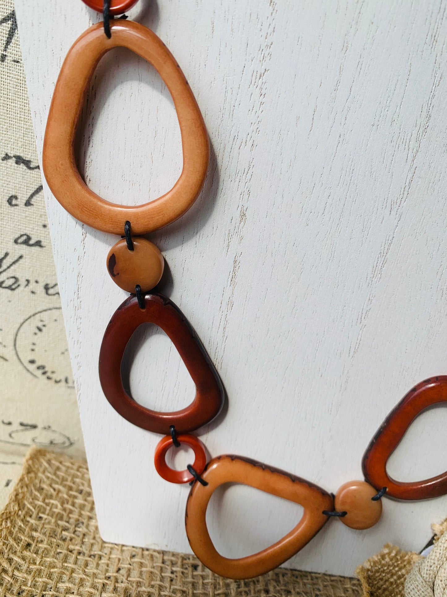 Brown Tagua necklace Fall fashion trends 2023 Statement geometric jewelry Donut beads Modern adjustable collar Lightweight extra long