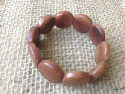 Tagua bracelet Brown beaded bracelet Artsy gifts Fall fashion 2025s Disk bead bracelet Stretch bead bracelet Wearable art Fall fashion