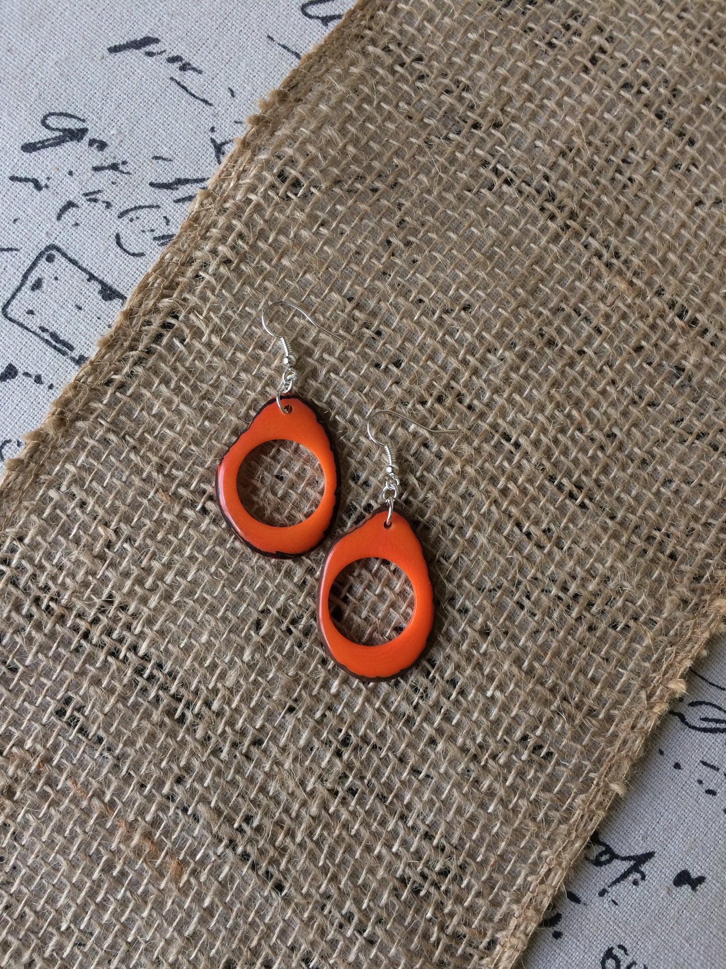 Tagua earrings Fall fashion trends Orange beaded earrings Dangly drop earrings Wearable art Fall fashion 2025s Statement handmade earrings