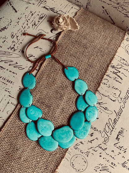 Turquoise green statement necklace made of tagua nut from artisans in Ecuador.
Double layer adjustable necklace. Lightweight jewelry.
For beach cruise.
Gift ideas for mom wife women.