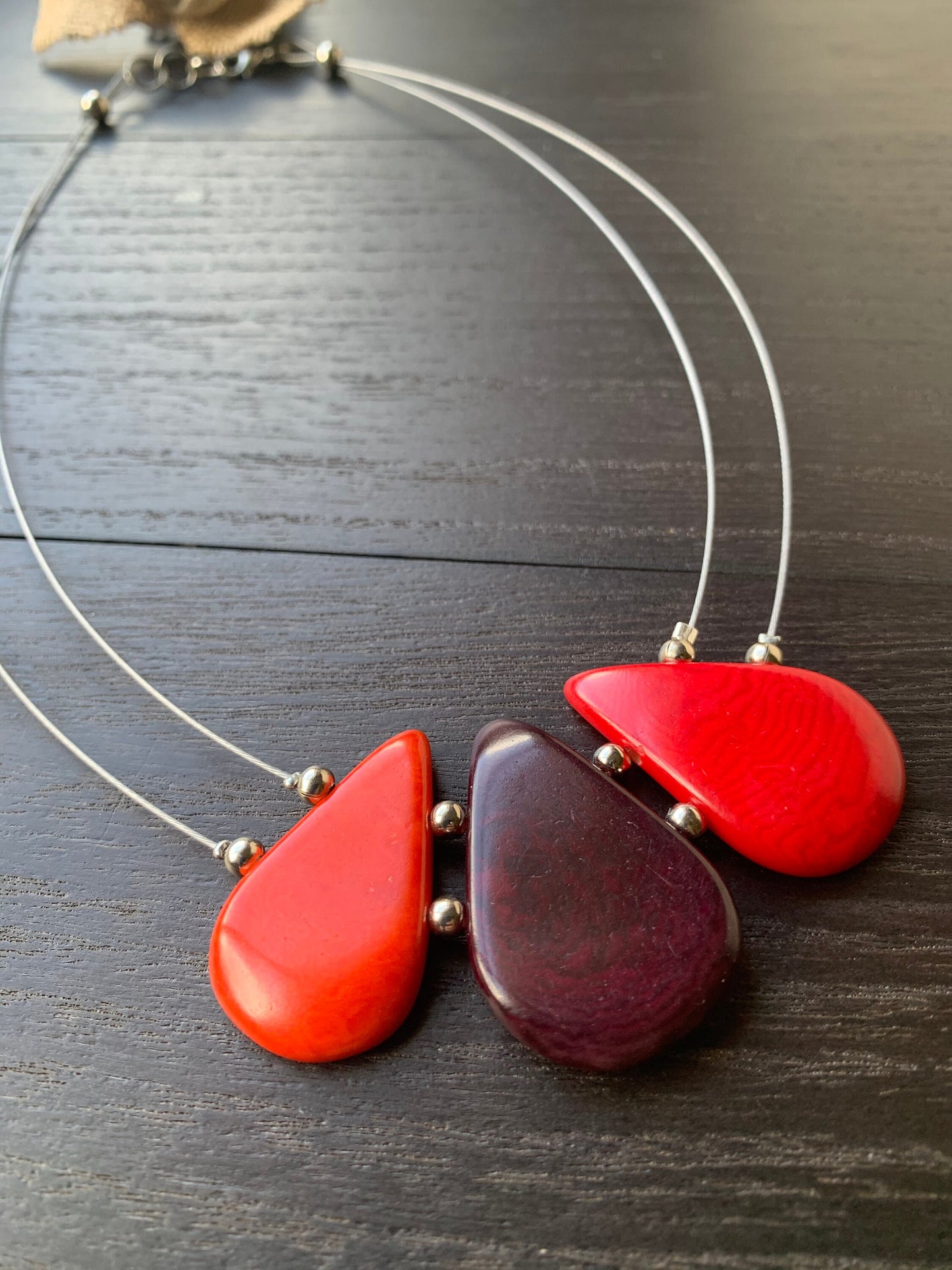 Red and maroon teardrop necklace Tagua jewelry Fall fashion 2025s Beach fashion Wearable art Handmade beaded necklace Statement pendant