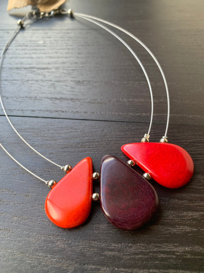 Red and maroon teardrop necklace Tagua jewelry Fall fashion 2025s Beach fashion Wearable art Handmade beaded necklace Statement pendant