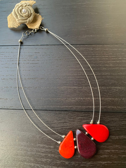 Red and maroon teardrop necklace Tagua jewelry Fall fashion 2025s Beach fashion Wearable art Handmade beaded necklace Statement pendant