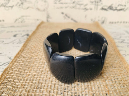 Black statement bracelet Tagua jewelry Big bold bangle Fall trends Fashion jewelry Wide cuff bangle Beaded stretch bracelet Art to wear