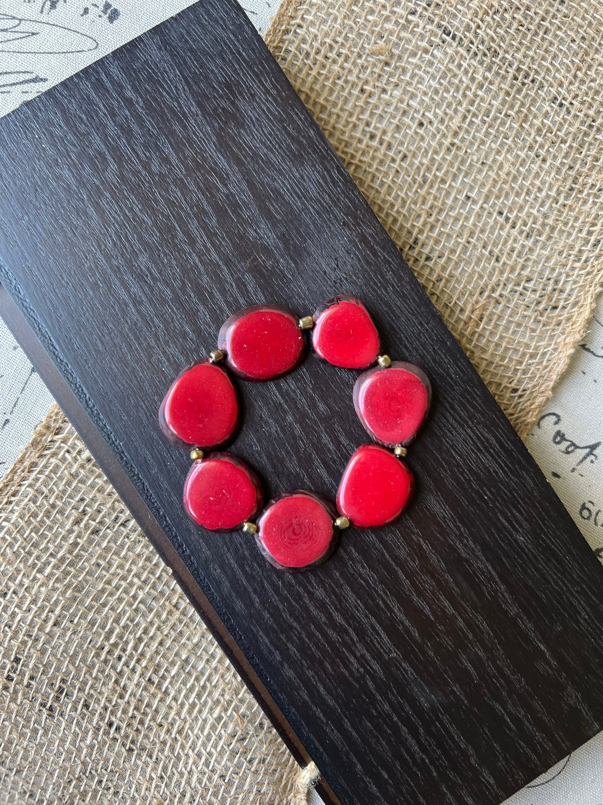 Red fashion bracelet Tagua jewelry Fall fashion trends Beaded stretch bracelets for women Statement bangle Geometric beads Wearable Art