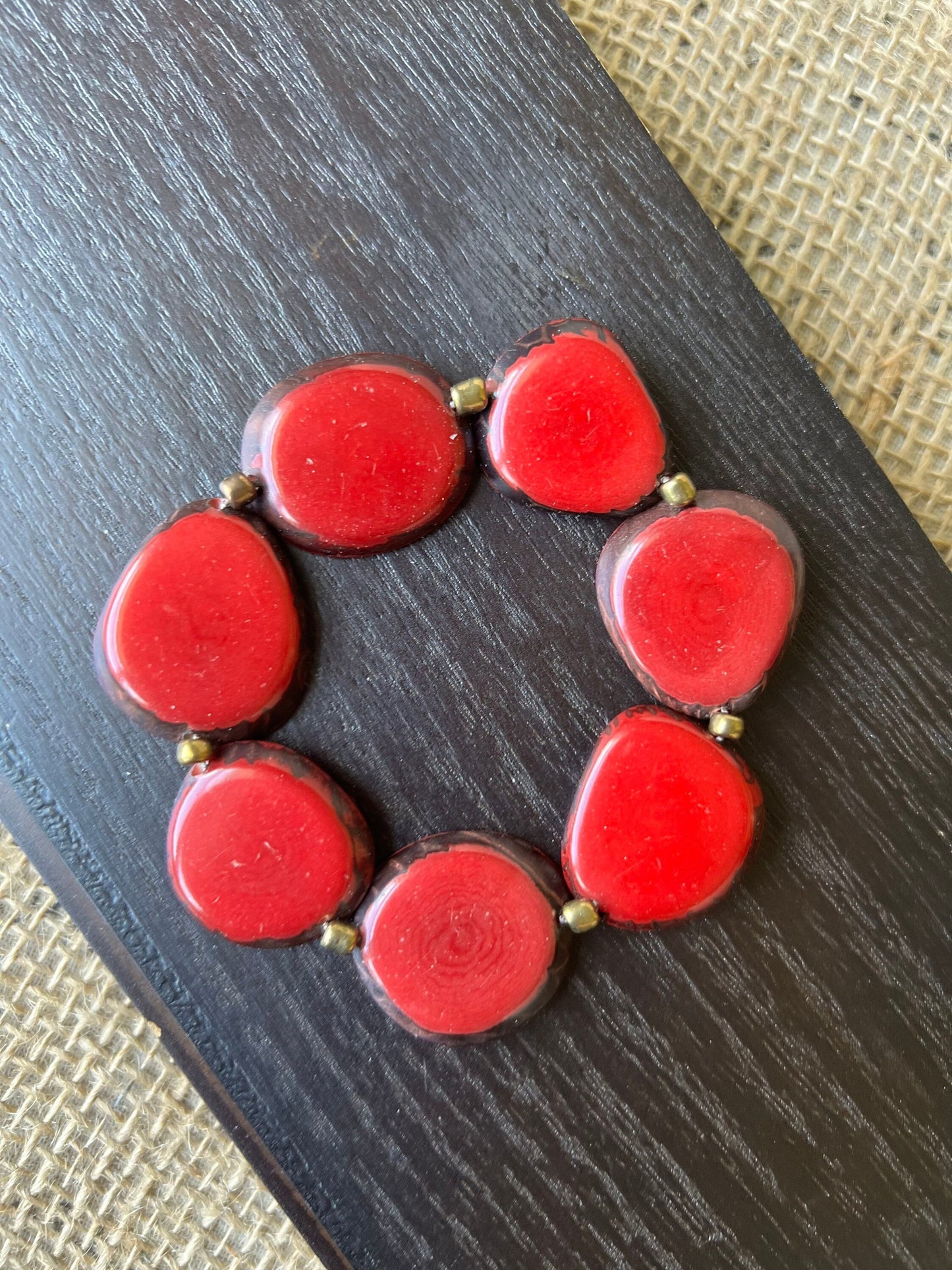 Red fashion bracelet Tagua jewelry Fall fashion trends Beaded stretch bracelets for women Statement bangle Geometric beads Wearable Art