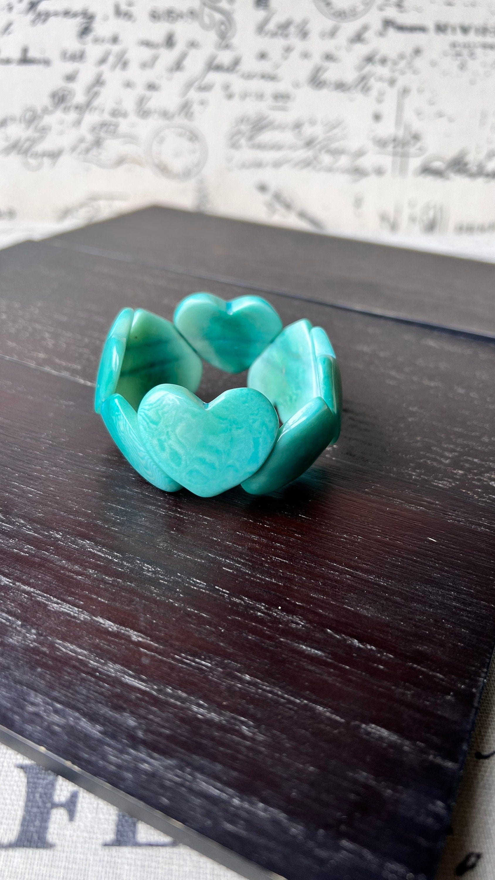 Turquoise green heart shaped bracelet Tagua jewelry Statement beaded bangle Fall fashion 2025 Wearable art Handmade beaded elastic bangle
