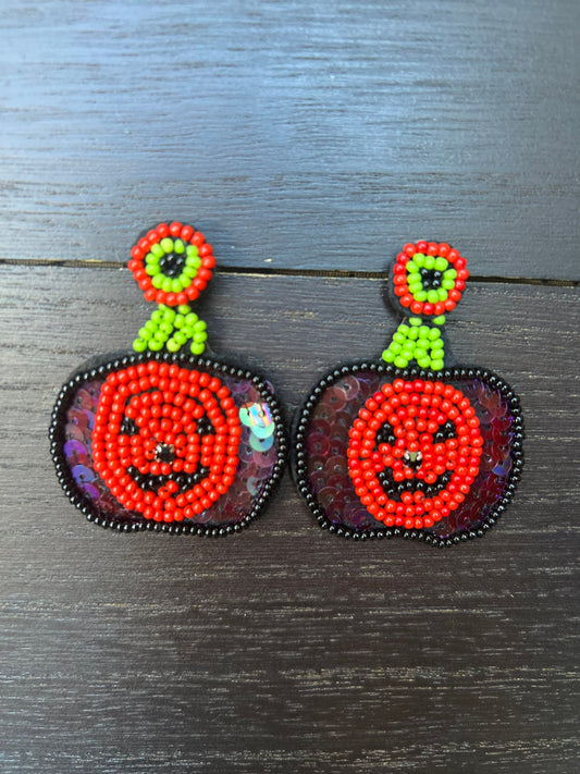 Halloween jewelry for women Pumpkin dangle earrings Seed bead drop earrings Fall fashion trend Orange statement earrings Autumn party gifts