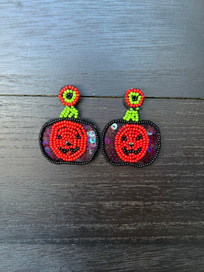 Halloween jewelry for women Pumpkin dangle earrings Seed bead drop earrings Fall fashion trend Orange statement earrings Autumn party gifts