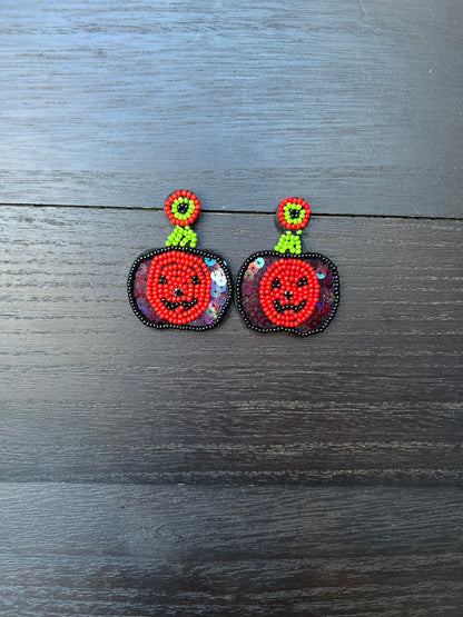 Halloween jewelry for women Pumpkin dangle earrings Seed bead drop earrings Fall fashion trend Orange statement earrings Autumn party gifts