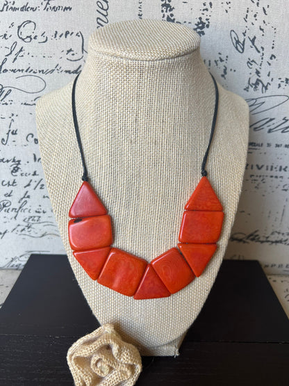 Orange beaded necklace Tagua jewelry Adjustable cord Lightweight Fall fashion trends Fall fashion 2025 Wearable art Simple necklace
