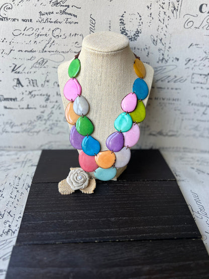 Rainbow pastel colors statement necklace made of tagua nut from artisans in Ecuador.
Double layer adjustable necklace. Lightweight jewelry.
For beach cruise.
Gift ideas for mom wife women.