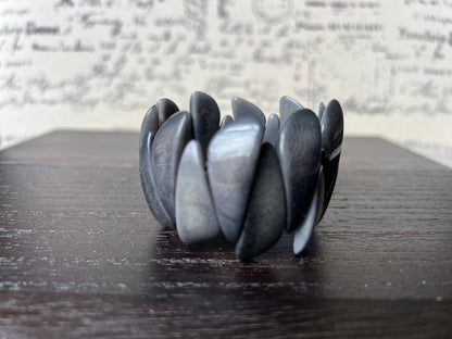 Dark gray statement bracelet made of tagua nut from artisans in Ecuador.
Stretchy bracelet. Lightweight jewelry.
For beach cruise.
Gift ideas for mom wife women.