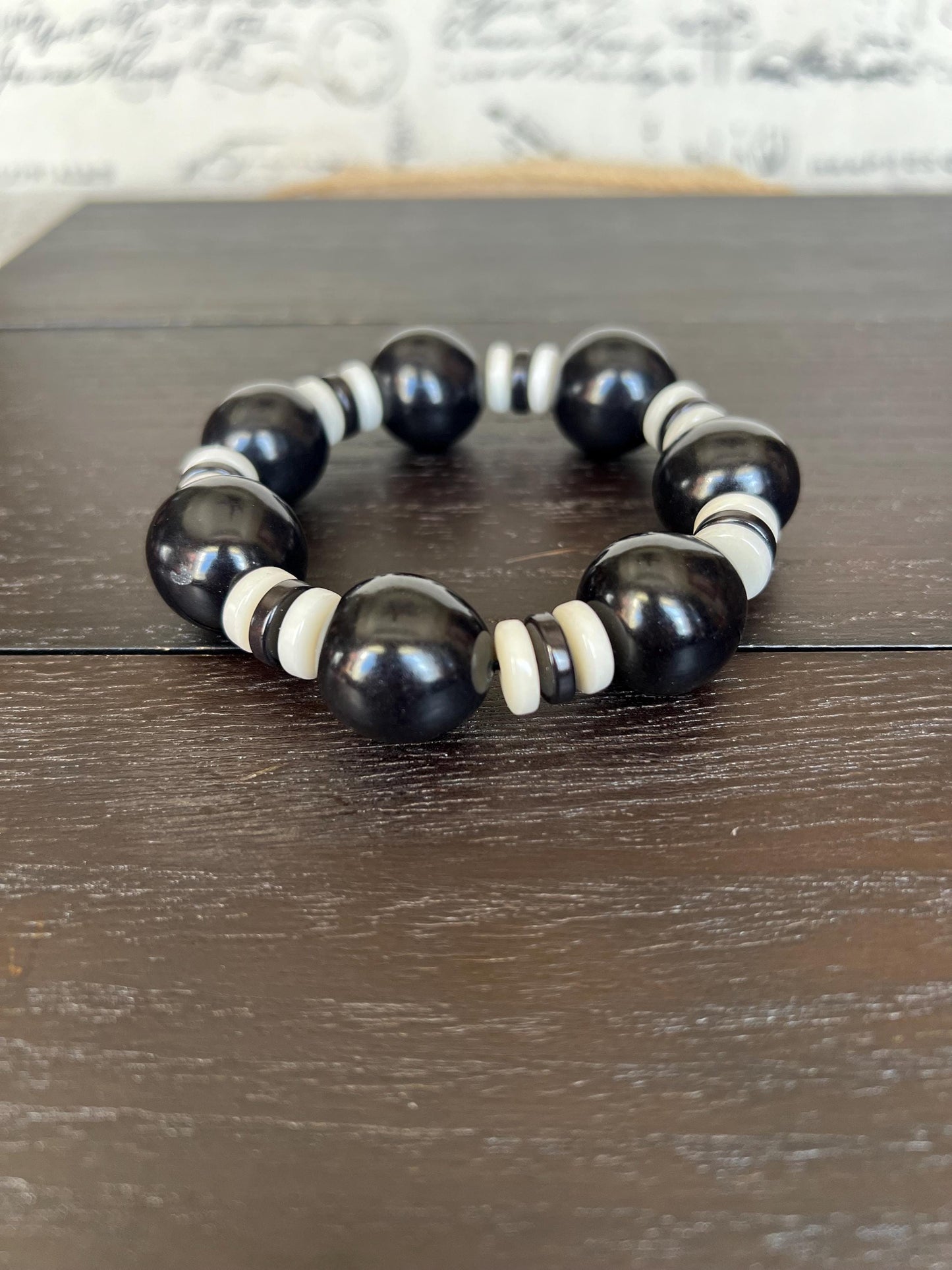 Black and white statement bracelet Tagua jewelry Big bold bangle Wearable art Fall fashion 2025s Trendy custom jewelry Stretch elastic