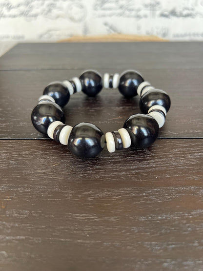 Black and white statement bracelet Tagua jewelry Big bold bangle Wearable art Fall fashion 2025s Trendy custom jewelry Stretch elastic