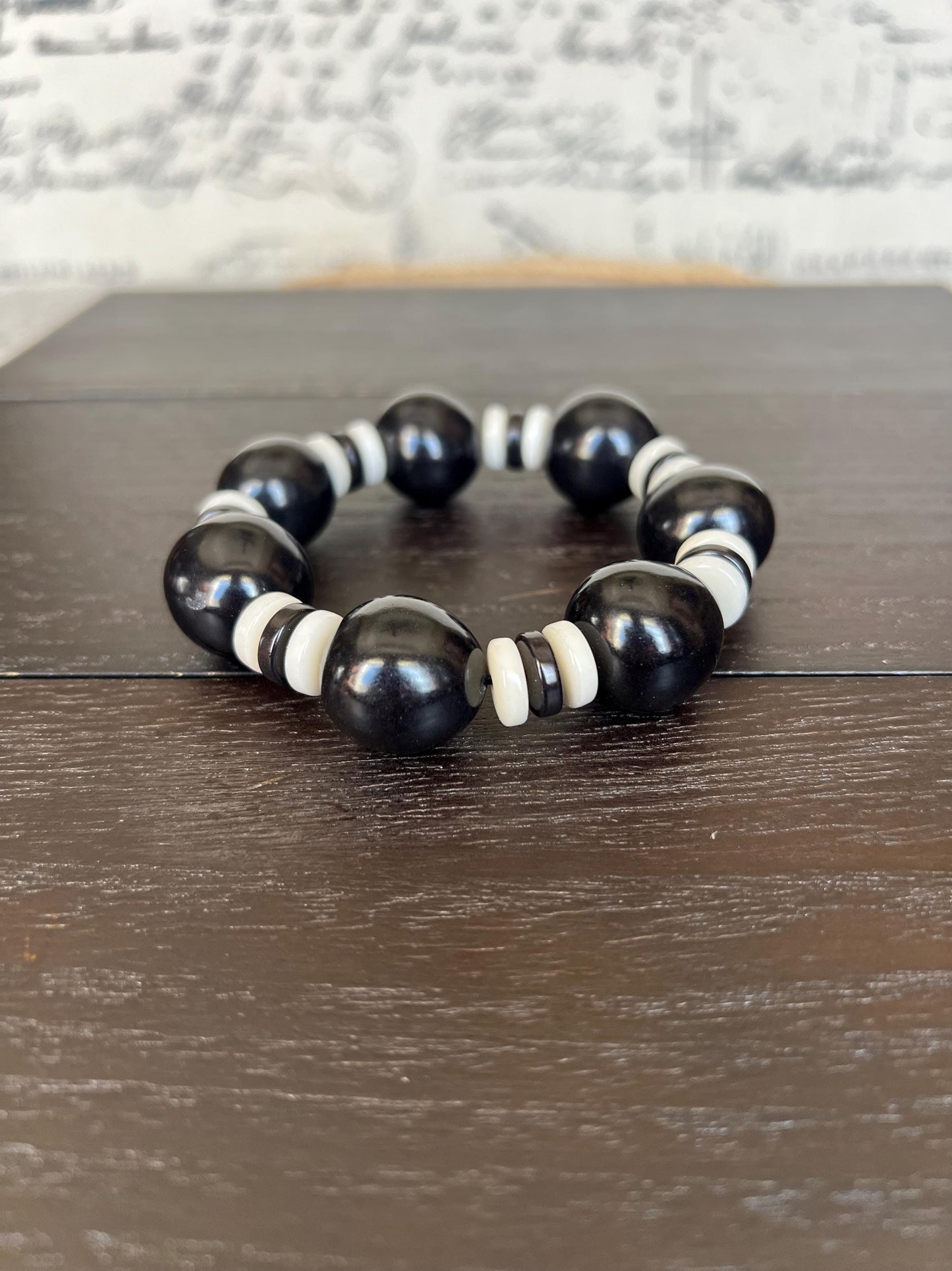 Black and white statement bracelet Tagua jewelry Big bold bangle Wearable art Fall fashion 2025s Trendy custom jewelry Stretch elastic