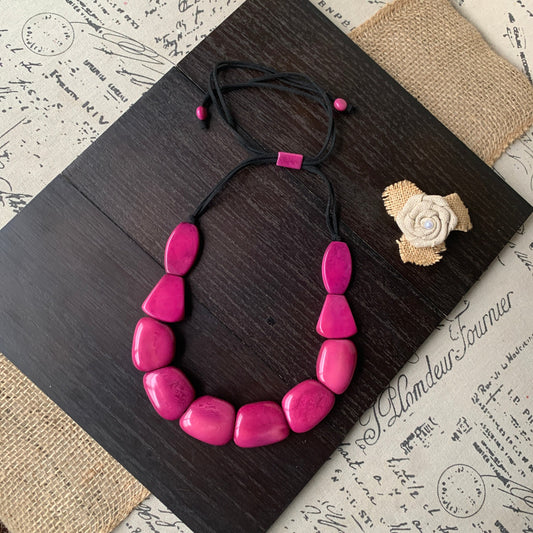 Magenta necklace.
Tagua nut necklace.
Statement jewelry.
Eco friendly gifts.
Big bold necklaces.
Galapagos tagua.
Unique jewelry gifts.