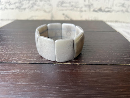 Grey beaded bracelet Tagua nut jewelry Wide cuff bangle Art to wear Elastic stretch bracelet Fall fashion 2025 Wearable art Statement bangle