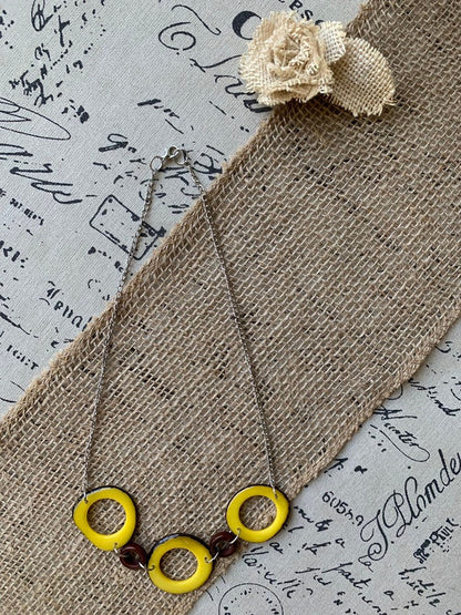 Yellow Tagua nut necklace with silver chain Resort wear Lightweight jewelry Statement handmade beads Spring fashion trends Beach style