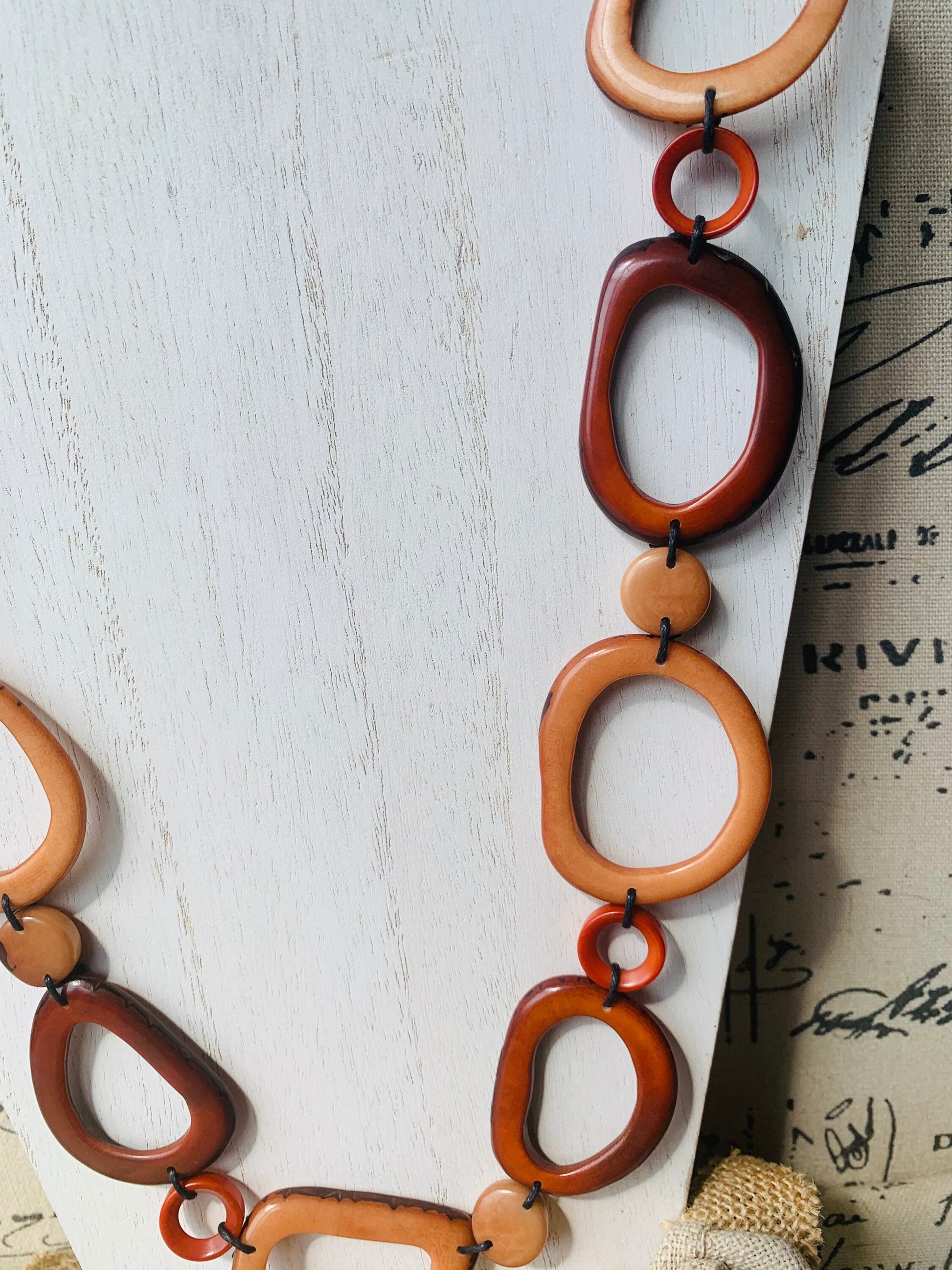 Brown Tagua necklace Fall fashion trends 2023 Statement geometric jewelry Donut beads Modern adjustable collar Lightweight extra long