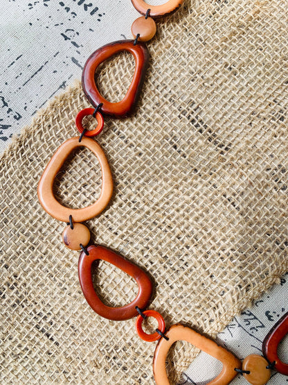 Brown Tagua necklace Fall fashion trends 2023 Statement geometric jewelry Donut beads Modern adjustable collar Lightweight extra long
