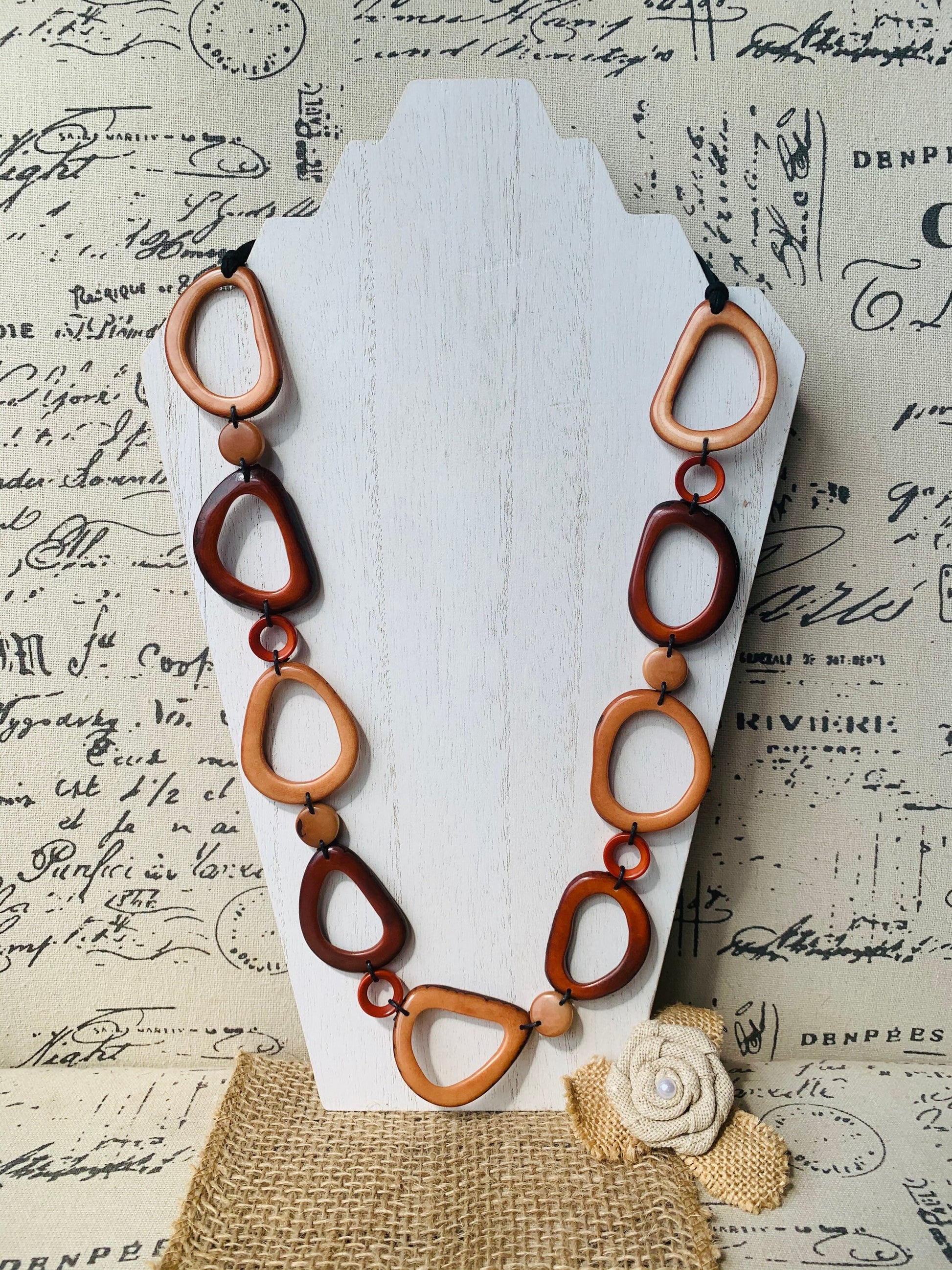 Brown Tagua necklace Fall fashion trends 2023 Statement geometric jewelry Donut beads Modern adjustable collar Lightweight extra long