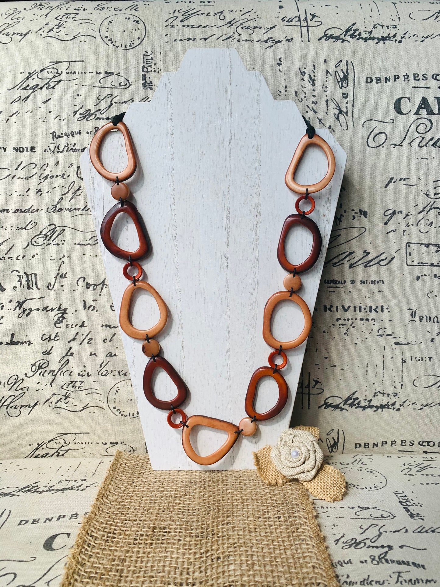 Brown Tagua necklace Fall fashion trends 2023 Statement geometric jewelry Donut beads Modern adjustable collar Lightweight extra long