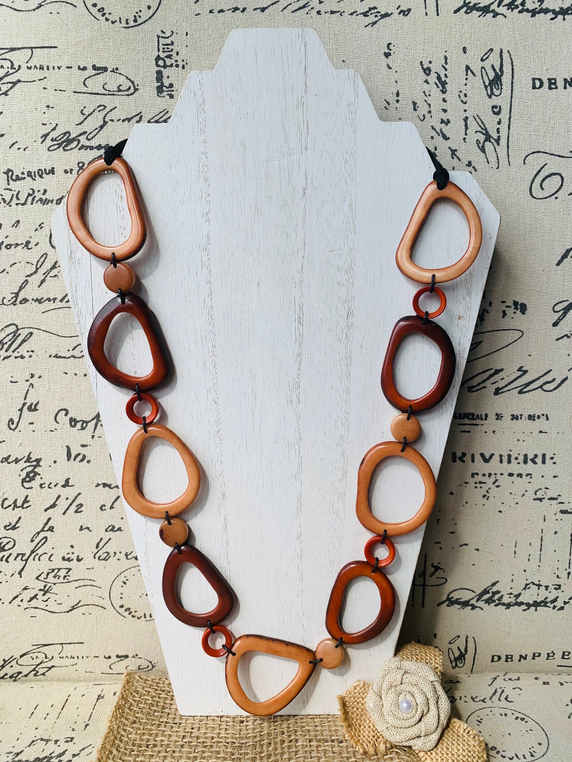 Brown Tagua necklace Fall fashion trends 2023 Statement geometric jewelry Donut beads Modern adjustable collar Lightweight extra long